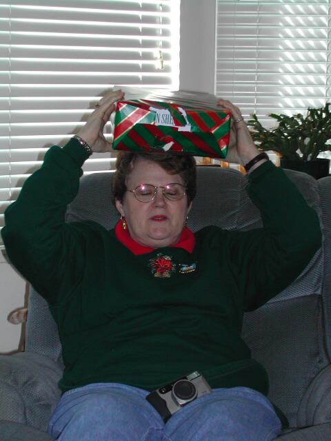 So I'll have to start explaining this weird phenomenom you'll see in our pictures. Everyone puts their presents on their head first because my Uncle Tom used to do this when I was kid. And he ALWAYS guessed right.